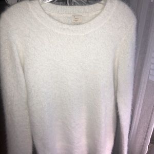 Women’s white fuzzy sweater. Very cozy, great for a holiday party!